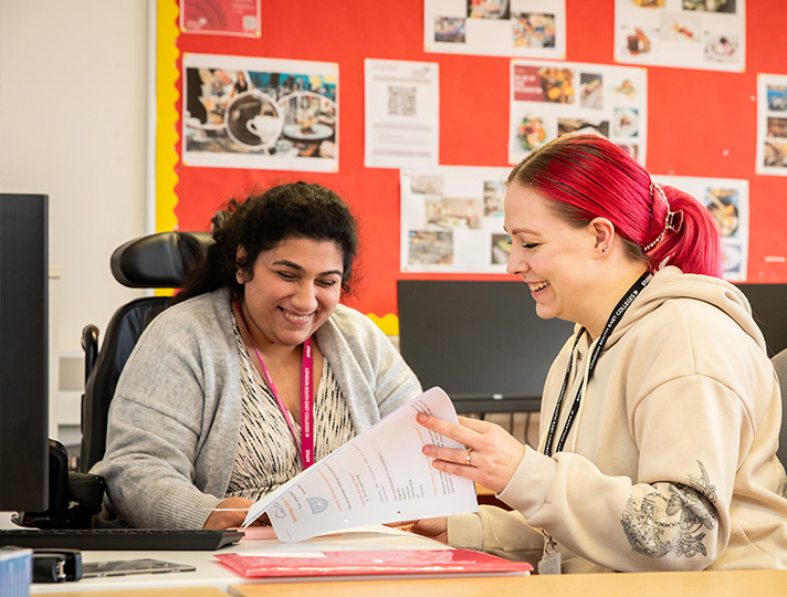 Student working at a desk in classroom